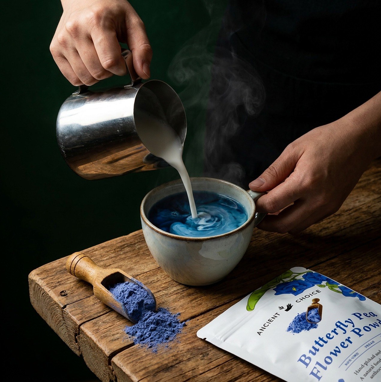 Pouring milk into a blue butterfly pea latte