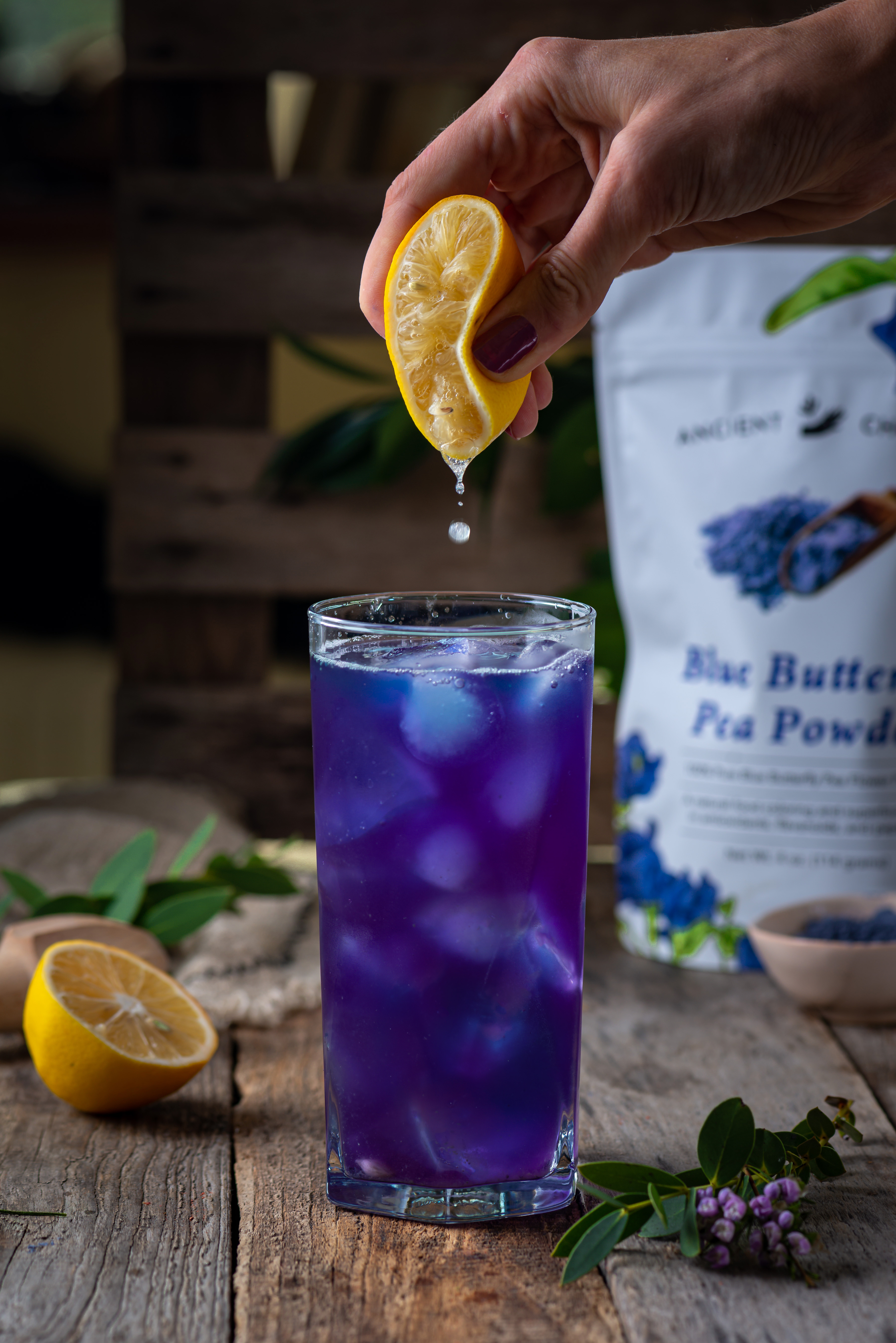 Butterfly pea lemonade with lemon squeeze
