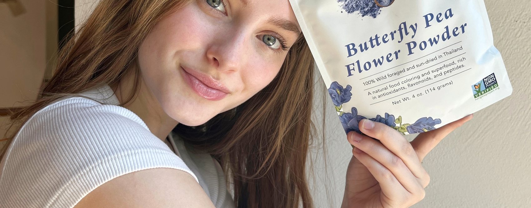 Customer holding a pouch of Ancient Choice Butterfly Pea Flower Powder